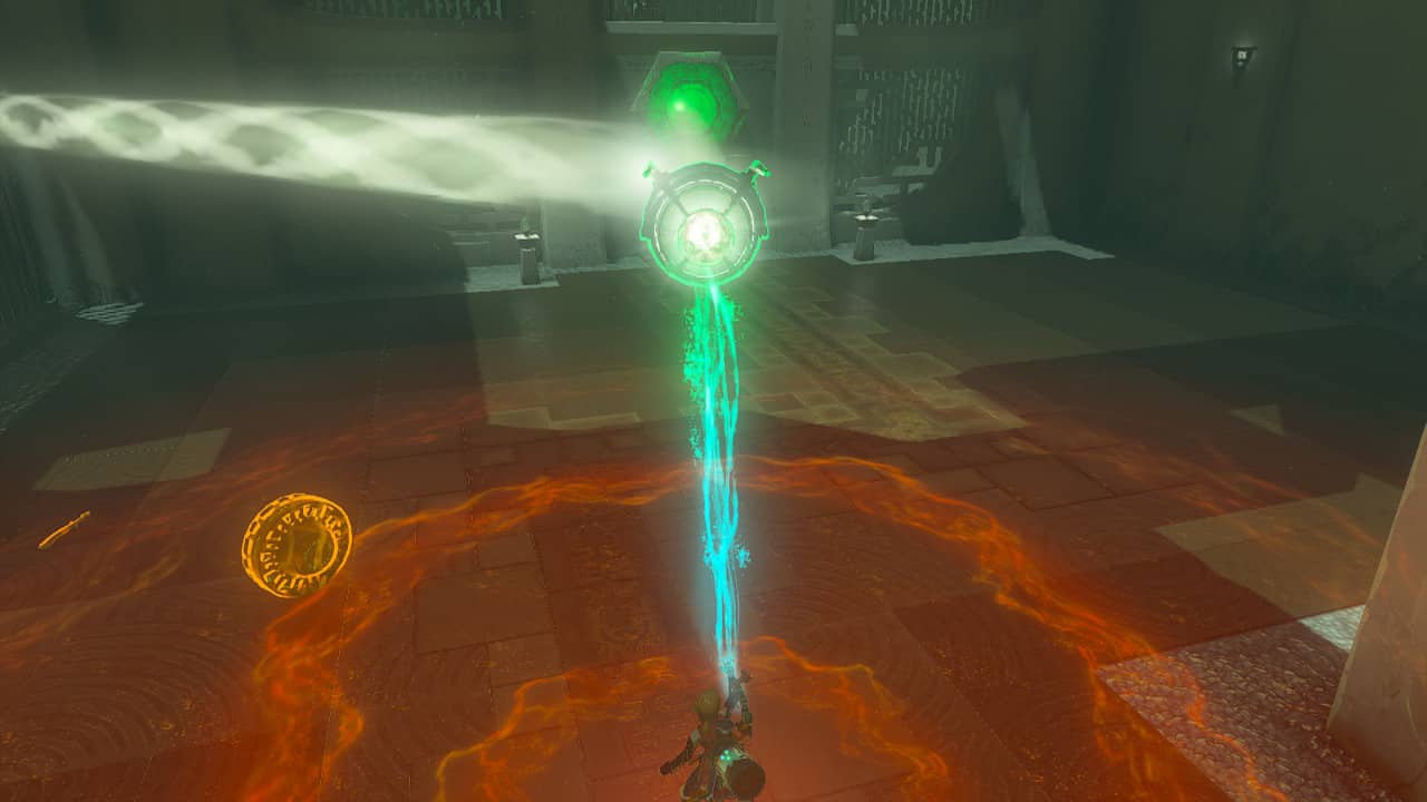 Tears of the Kingdom Soryotanog Shrine: Link holding a mirror using Ultrahand to reflect a beam of light at a green hexagonal switch.