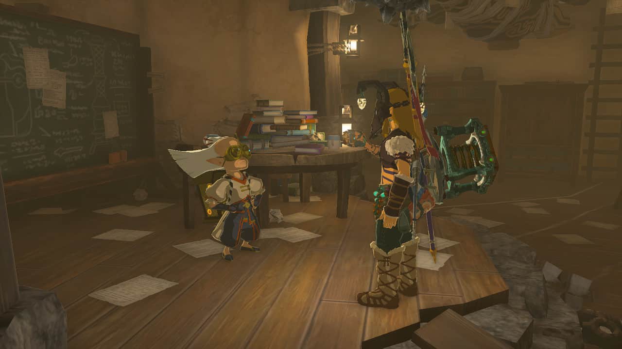 Tears of the Kingdom Travel Medallion: Link and Robbie in a room littered with paper and books.