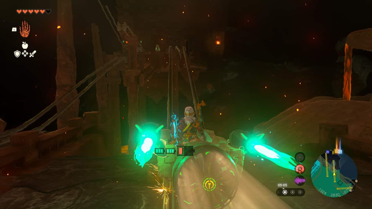 Tears of the Kingdom Fire Temple: Link riding a minecart with Zonai rockets and a fan attached.