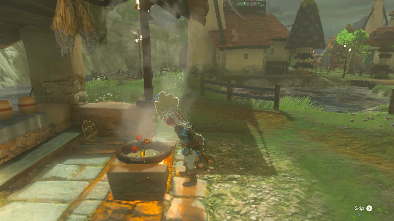 Tears of the Kingdom easter eggs: Link cooking with Hateno Village in the background.