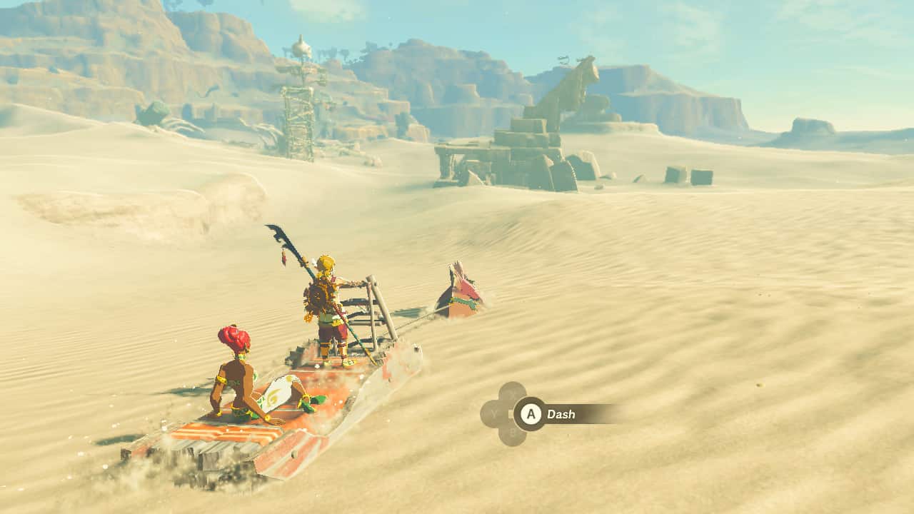 Tears of the Kingdom To The Ruins: Link and a Gerudo woman riding a sledge pulled by a Sand Seal.