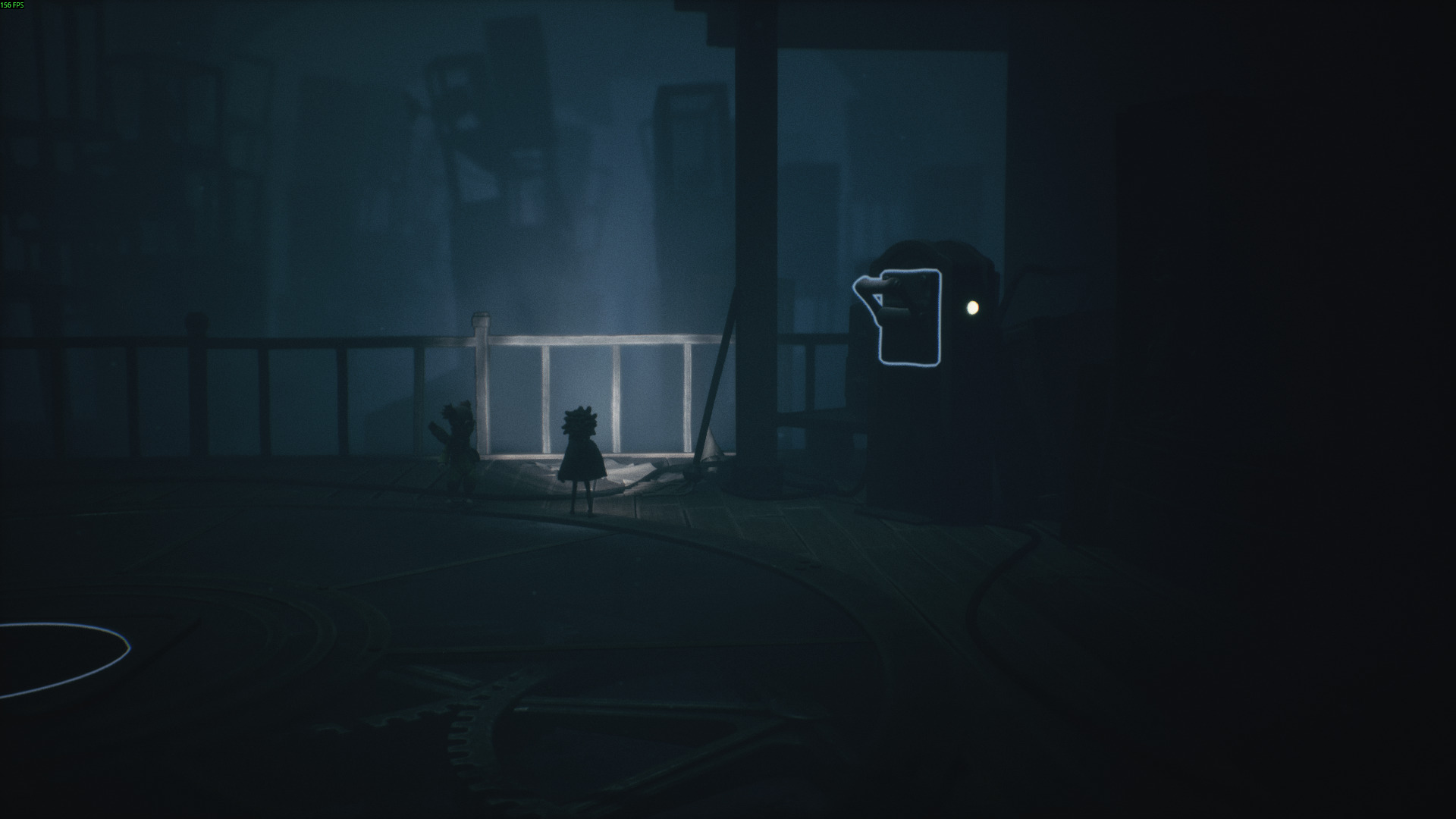 Two small characters stand near a glowing lever in Little Nightmares 3, surrounded by shadows and looming shapes in the dark