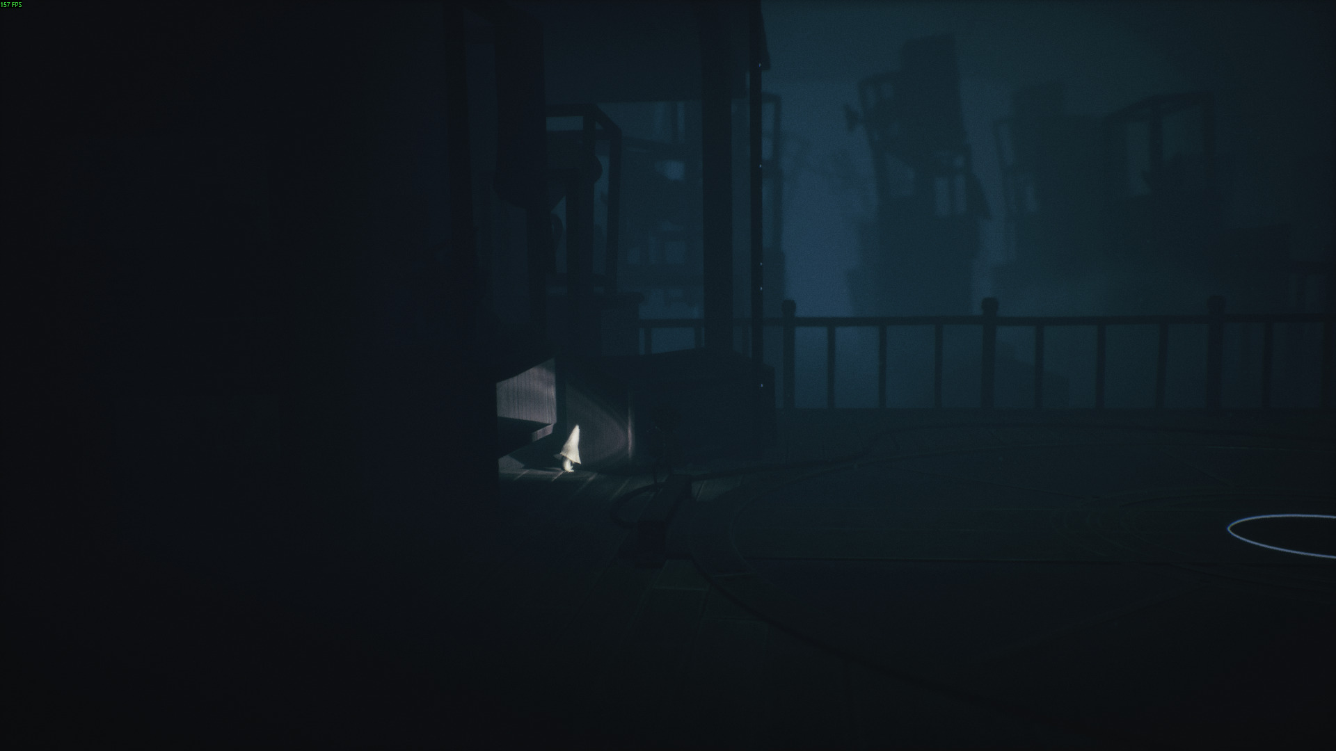 A small character with a pointed hat walks through shadows in Little Nightmares 3