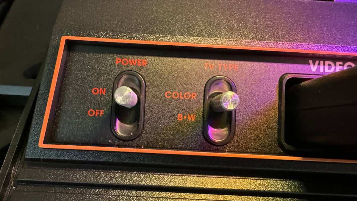 A close up of an Atari 2600 video game controller.