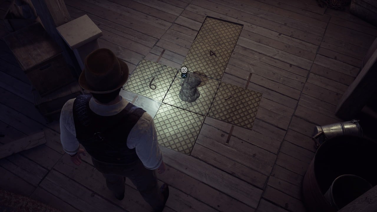 A character in the video game Alone in the Dark stands alone in a dark attic above a floor marked with a glowing cross, indicating an interaction point for a talisman puzzle solution.