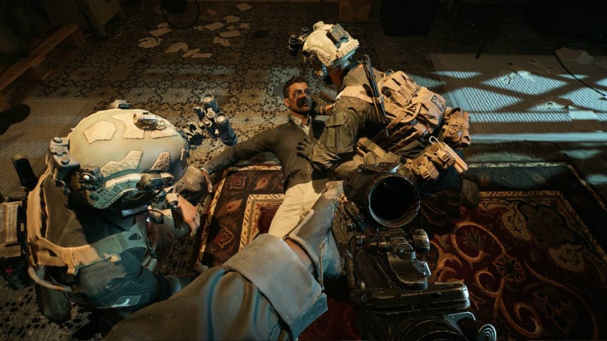 Two soldiers in tactical gear interrogate a captured man on the floor during a mission in Battlefield 6