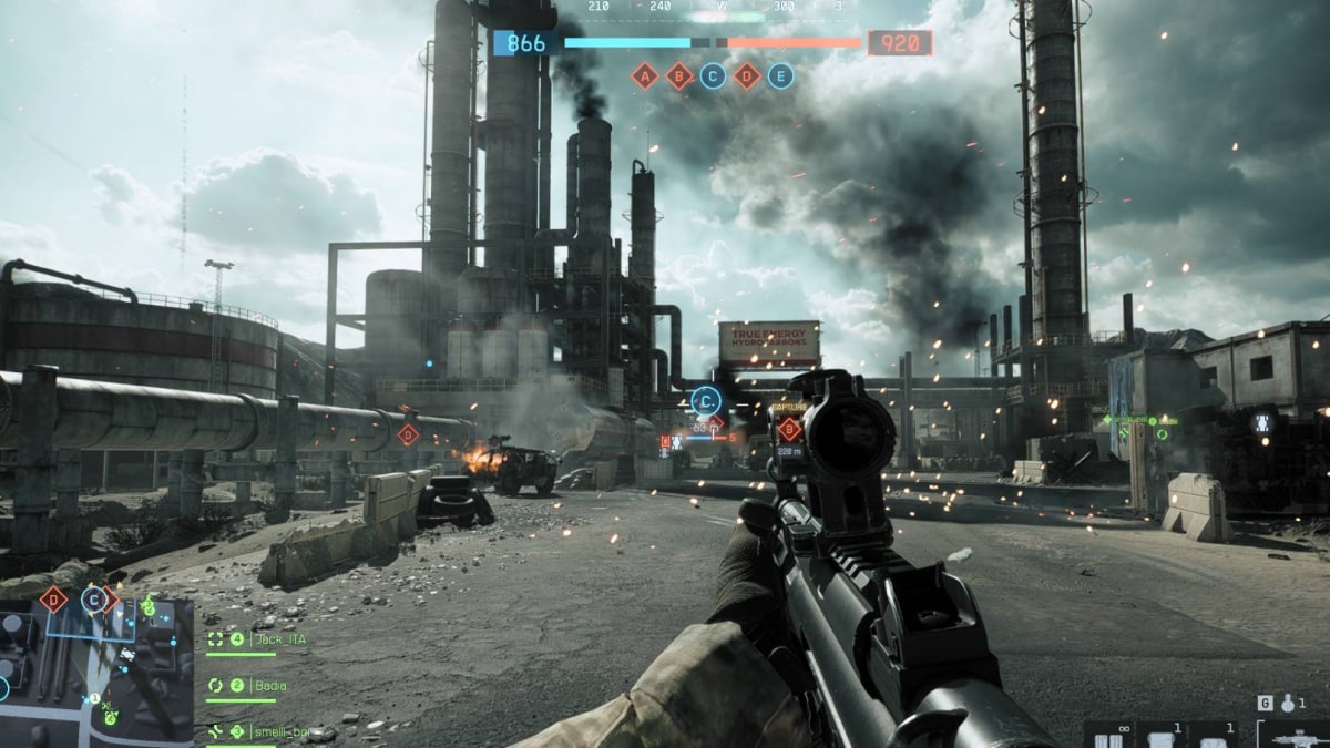 Player advances through an industrial combat zone under heavy fire in Battlefield 6 multiplayer