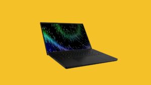 razer blade 16 laptop on a yellow background