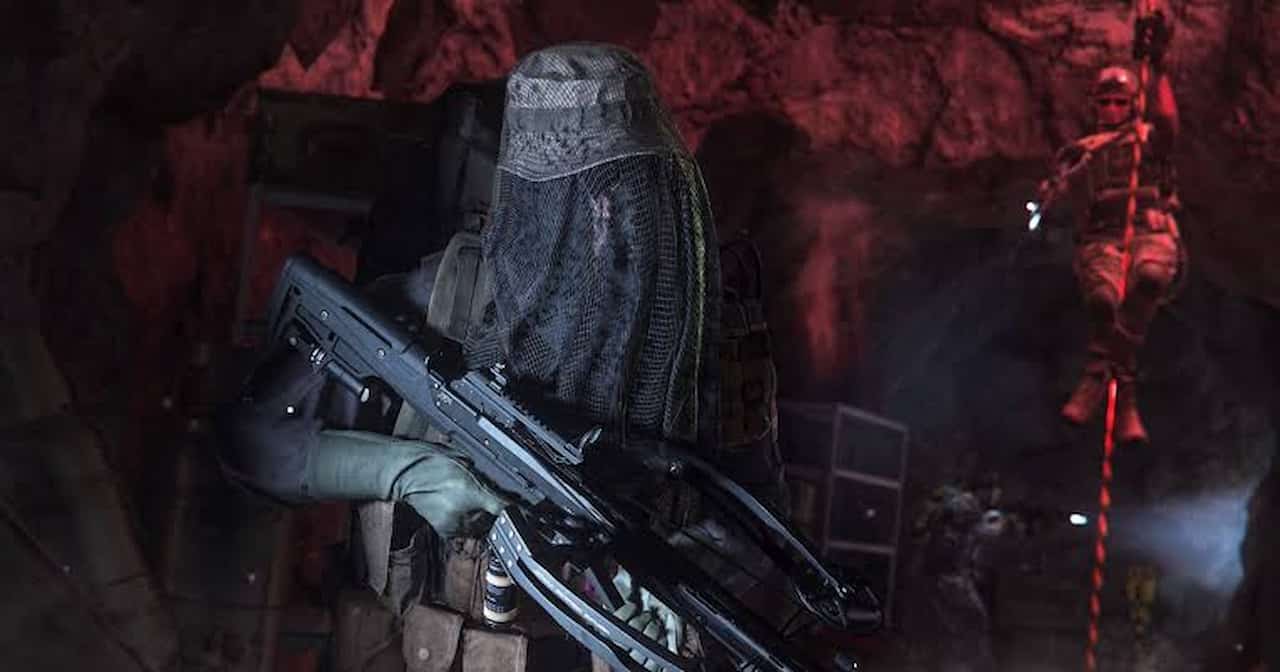 A man armed with a MW2 Crossbow takes cover in a cave.