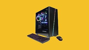 The best gaming PC for GW2, showcased on a yellow background with a keyboard and mouse.
