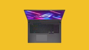 Asus ROG laptop on a yellow background, best gaming laptop for 2023.