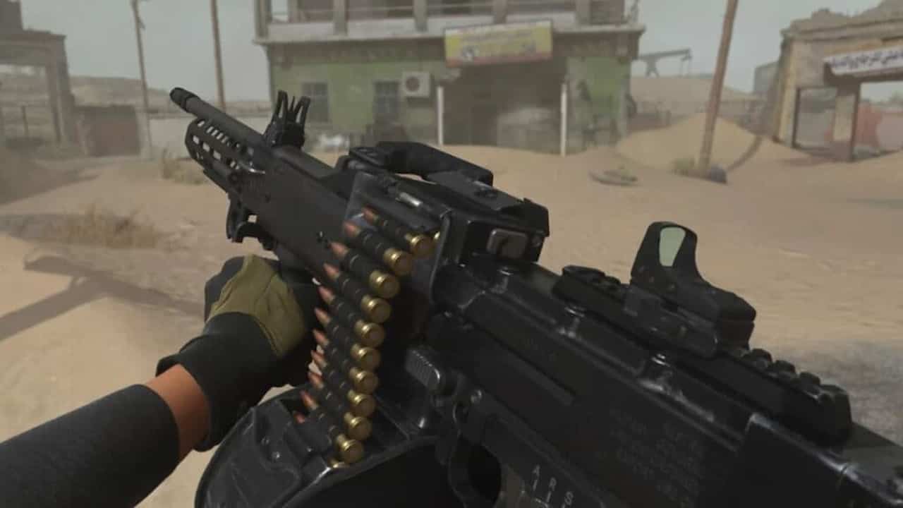 A screenshot of a gun in a modern warfare desert setting.