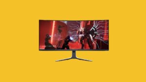 Alienware ultrawide gaming monitor on a yellow background