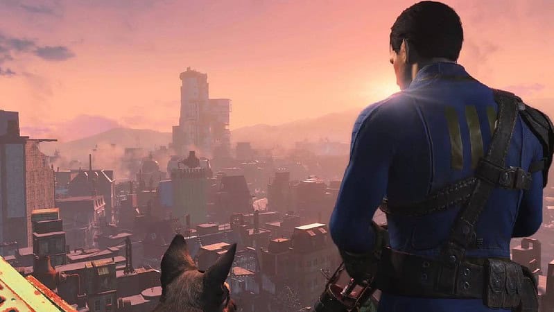 A man and his dog look out over a post-apocalyptic cityscape at sunset with the best graphics settings for Fallout 4.