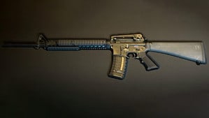 An M16 rifle on a black background.