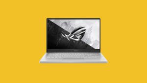 The ASUS ROG laptop on a yellow background, one of the best small laptops for gaming in 2023.