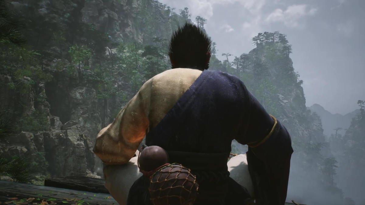 Black Myth Wukong: Depiction of Wukong, the monkey king over looking a bamboo forest and mountain from a game.
