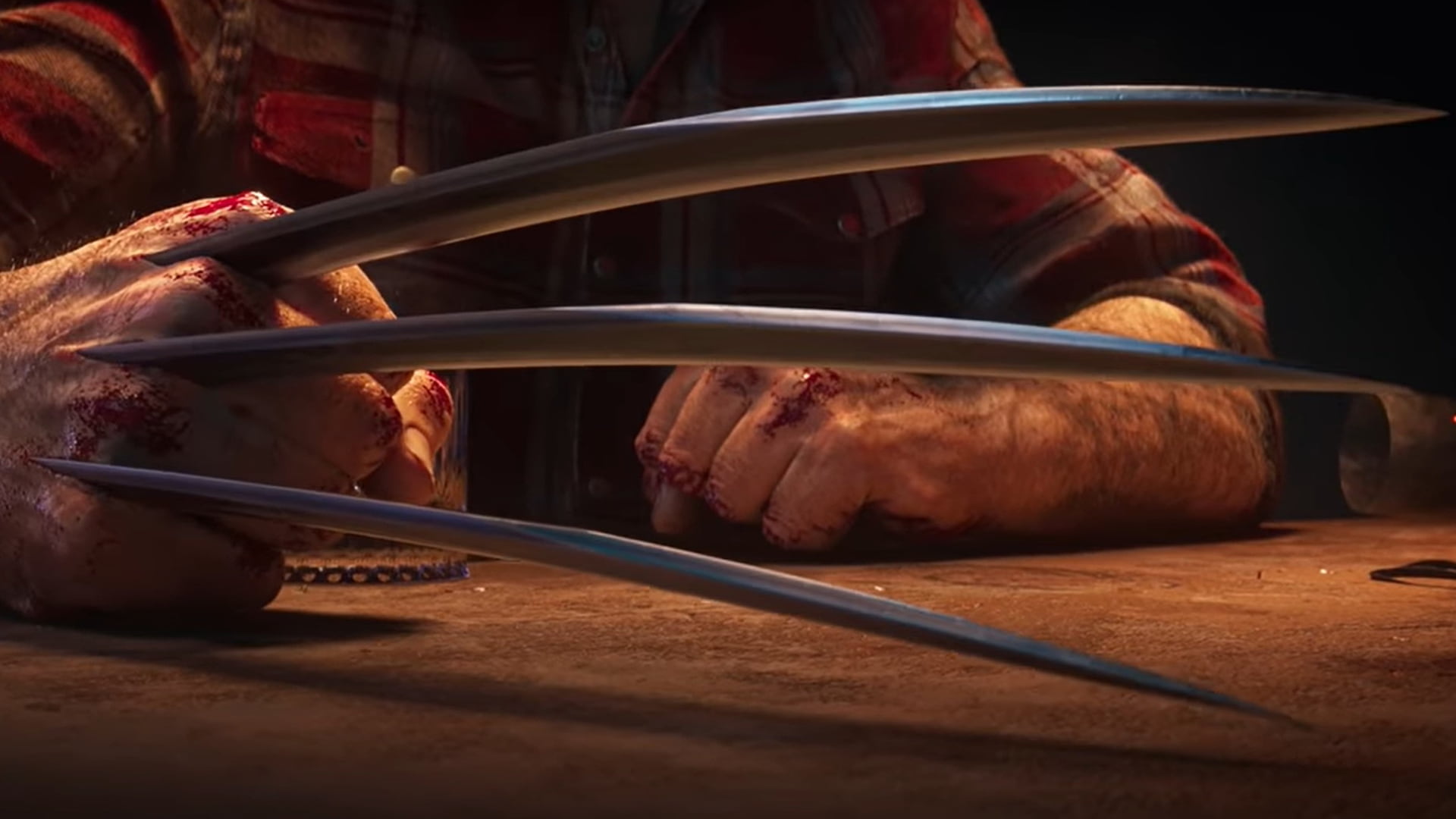 Wolverine’s bloody hands with extended claws on table
