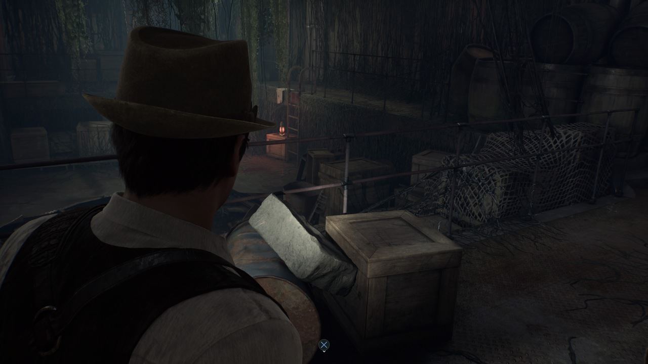 A character in a detective's outfit, alone in the dark, examining an area with wooden crates and barrels, possibly searching for clues.