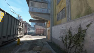 Counter Strike 2 release date: A shot of a back alleyway in an urban area on a map.