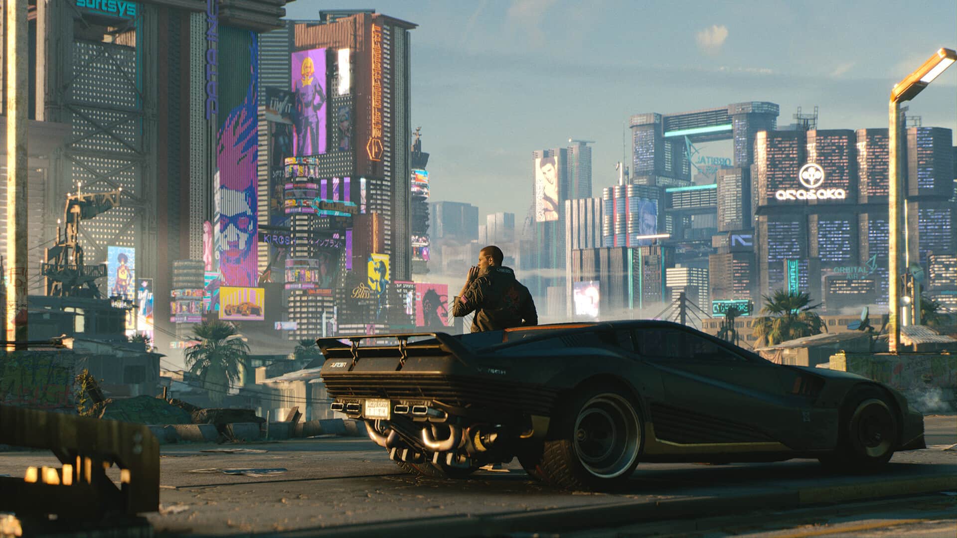 Character leaning on a car overlooking Night City in Cyberpunk 2077