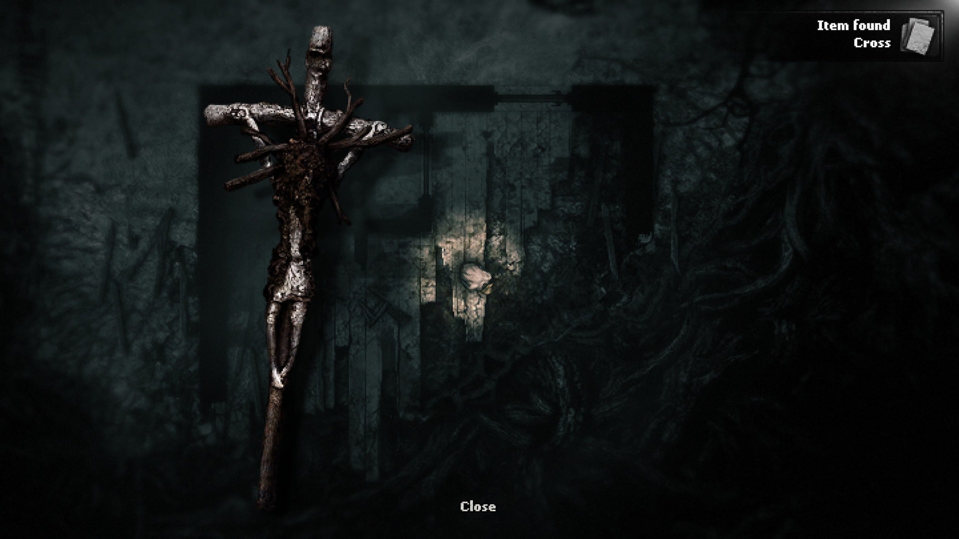 A close up of a handmade wooden cross item found by the player in Darkwood, illuminated by a faint flashlight in a decayed room.