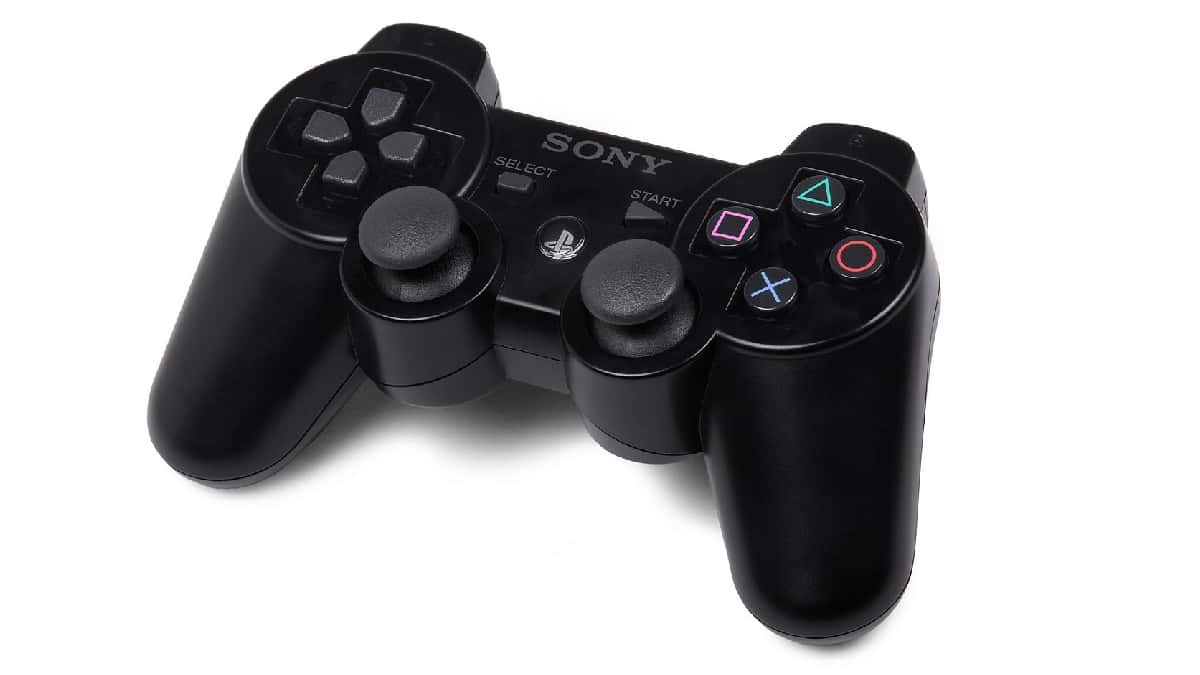 A black Sony PS3 controller on a white background, showcasing the evolution of PlayStation controllers.