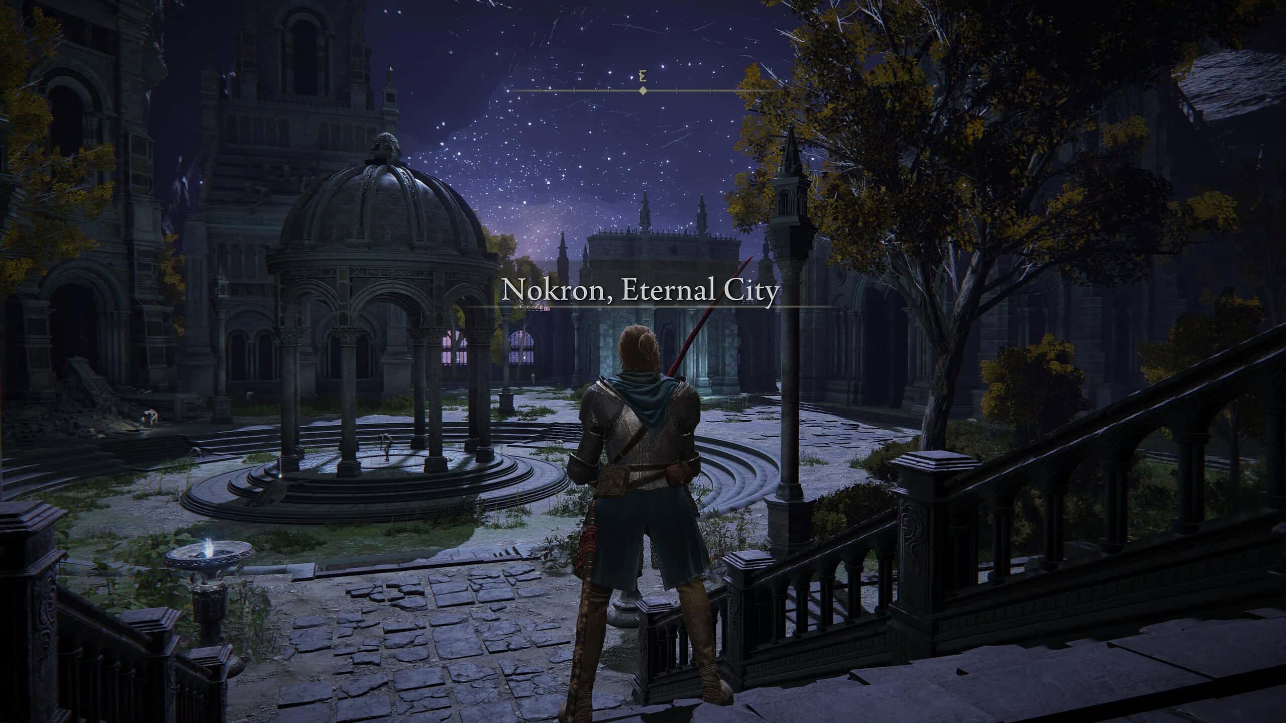 elden ring how to get to nokron, the eternal city - our character stands in a courtyard with stars overhead.