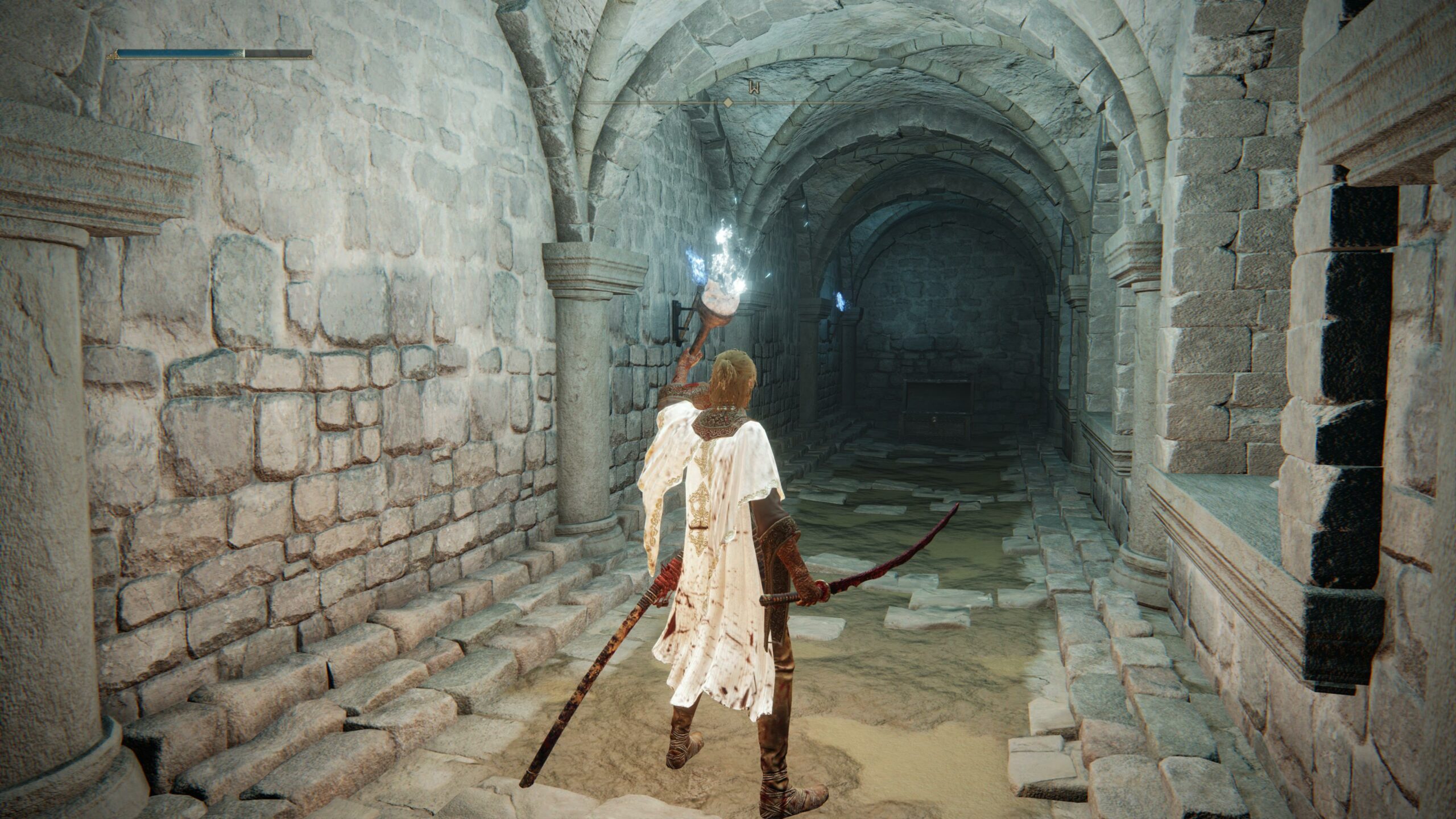 a woman holding a torch to reveal a stony passage