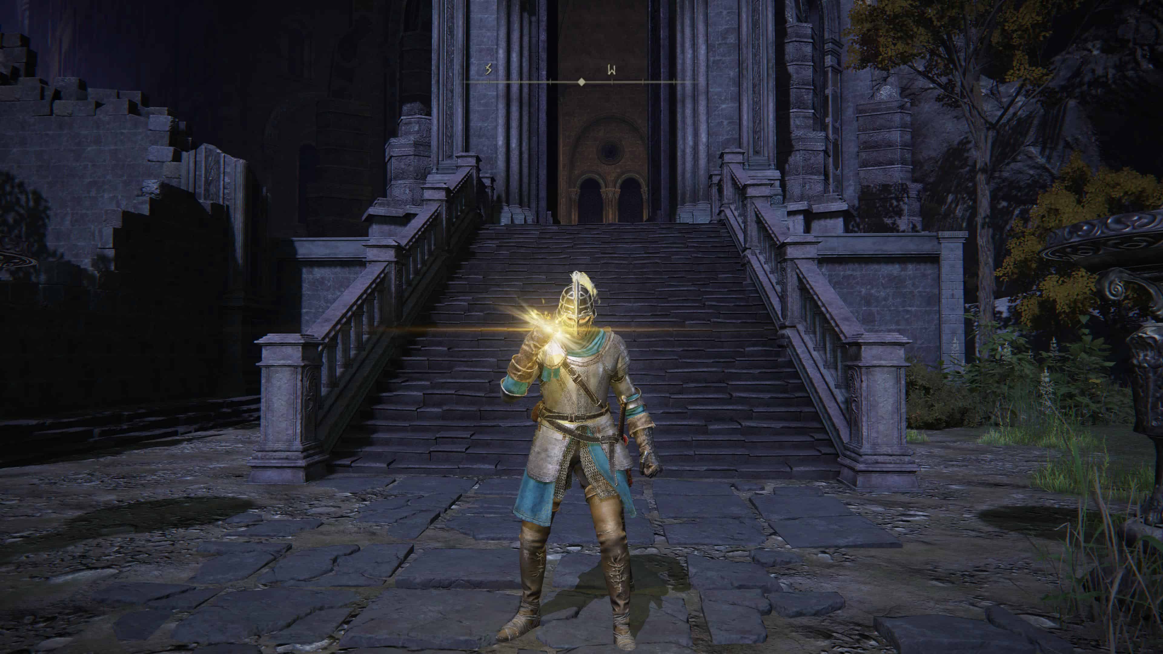 elden ring incantations - a knight's hand glows gold using magic