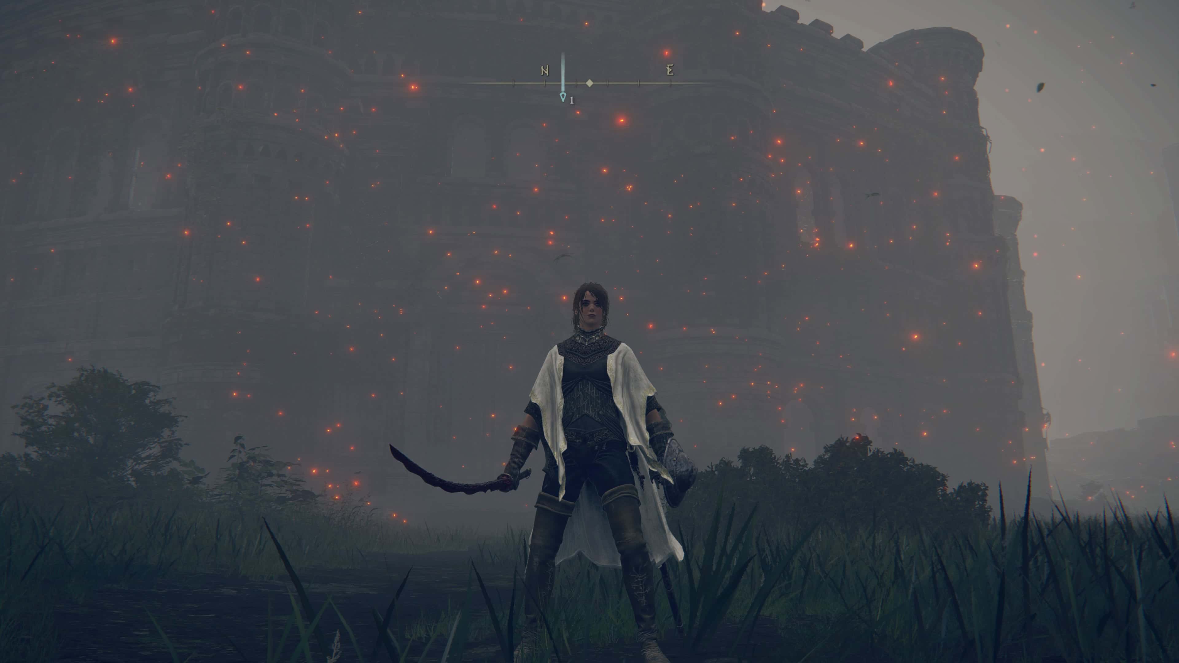 Elden ring colosseum locations - a woman with a sword stands outside a large colosseum