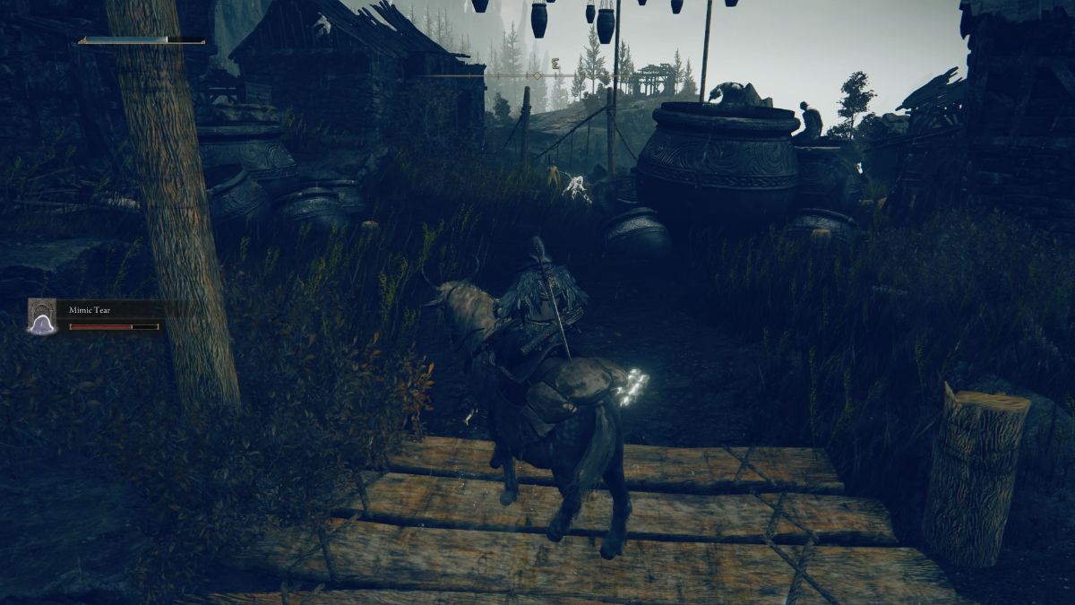 Elden Ring Shadow of the Erdtree Cathedral of Manus Metyr - Player crossing bridges in village