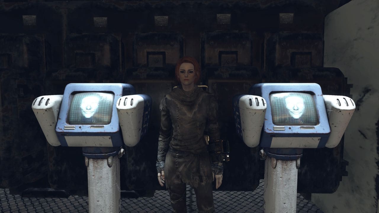 A woman is standing in front of two monitors displaying all mutations.