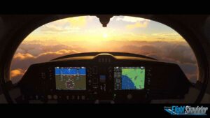 The cockpit of a plane with the best monitor for Flight Simulator, with a sun setting behind it.