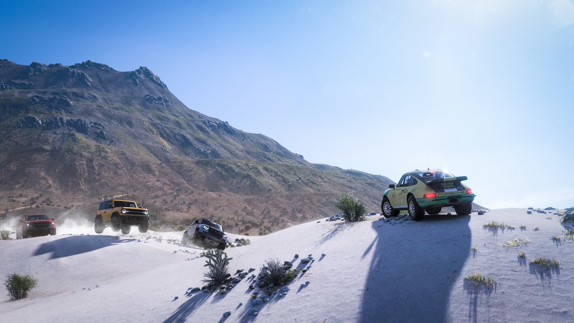 Off-road cars racing across sandy dunes in Forza Horizon 5’s open-world Mexico setting