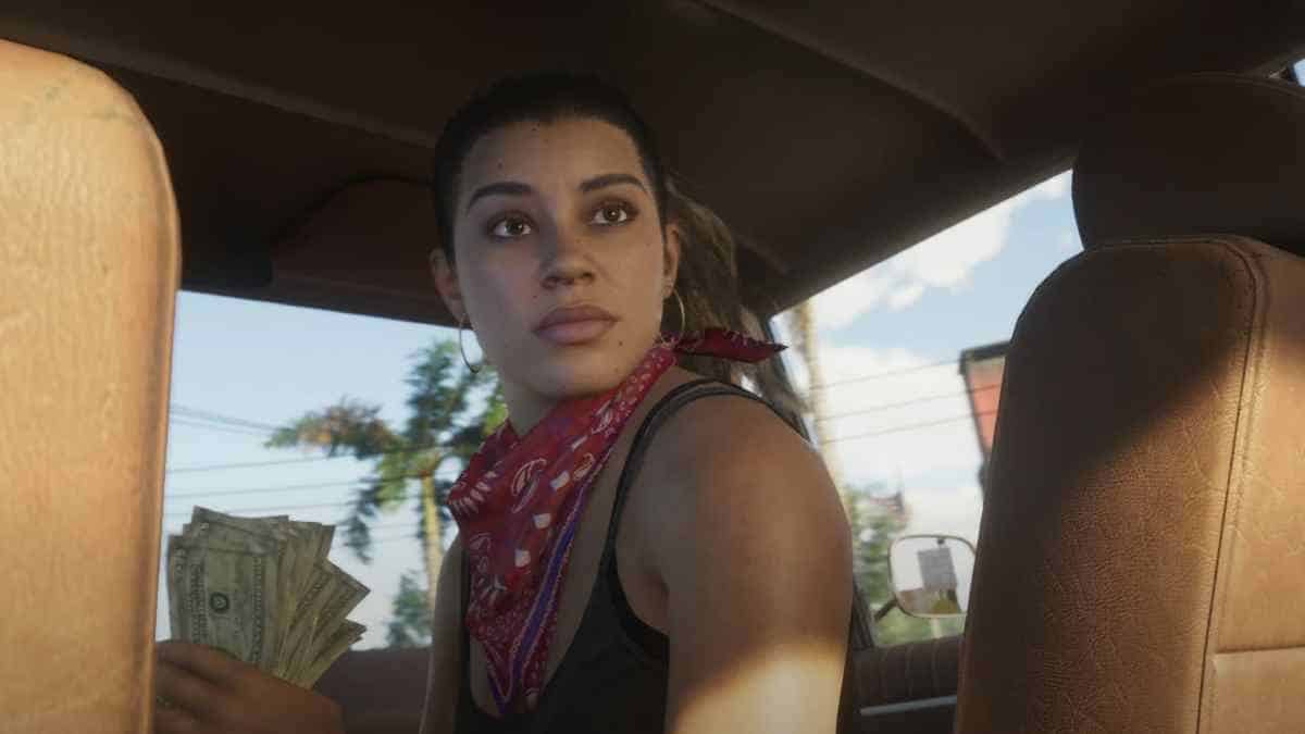 A screenshot of Lucia from the GTA 6 trailer. They're holding a wad of cash in the front seat of a car.