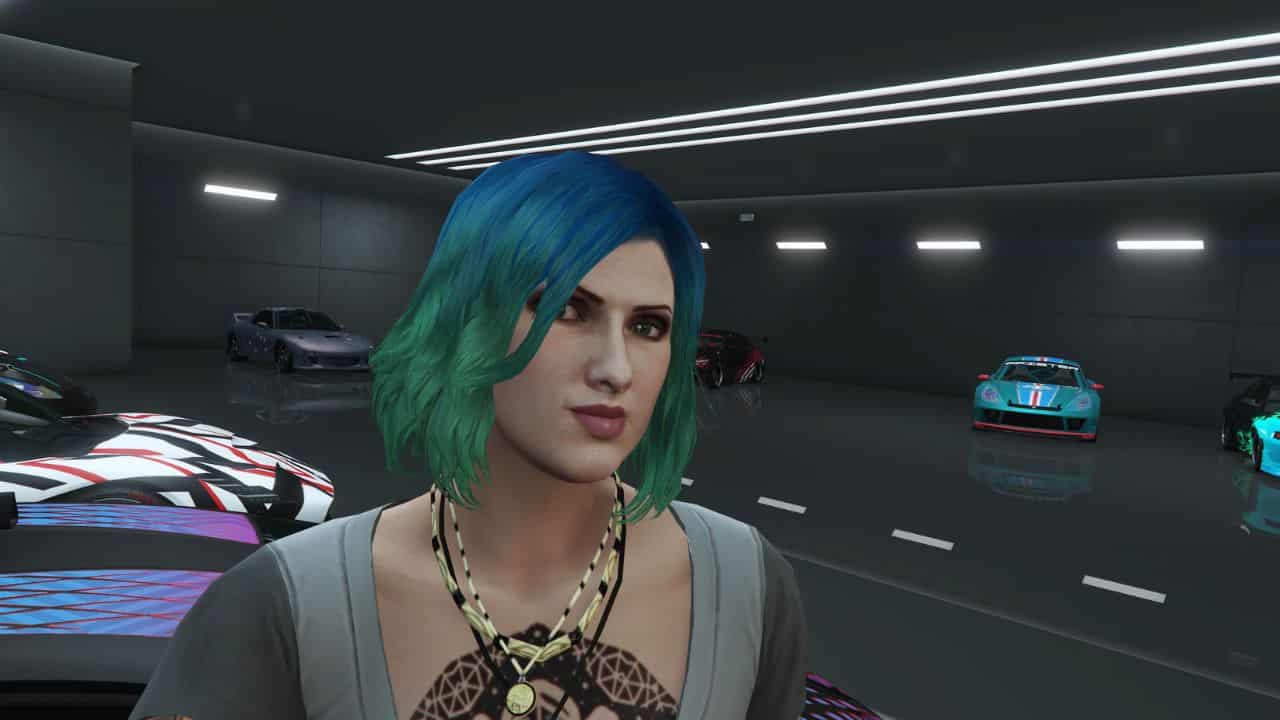 A woman with blue hair standing in a garage, pondering whether PS Plus is required to play GTA online.