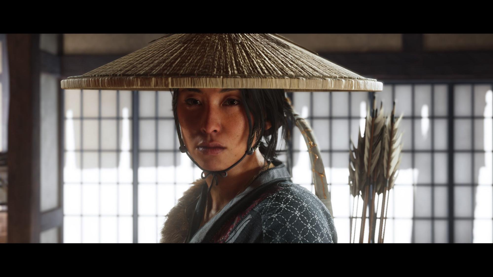 Close-up of Atsu wearing a straw hat in Ghost of Yotei