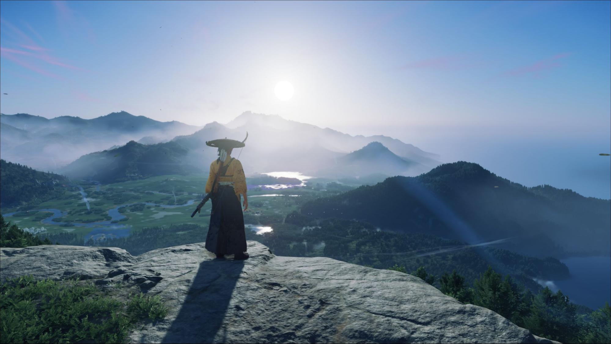 Warrior stands on a cliff watching the sunrise over mountains in Ghost of Yotei