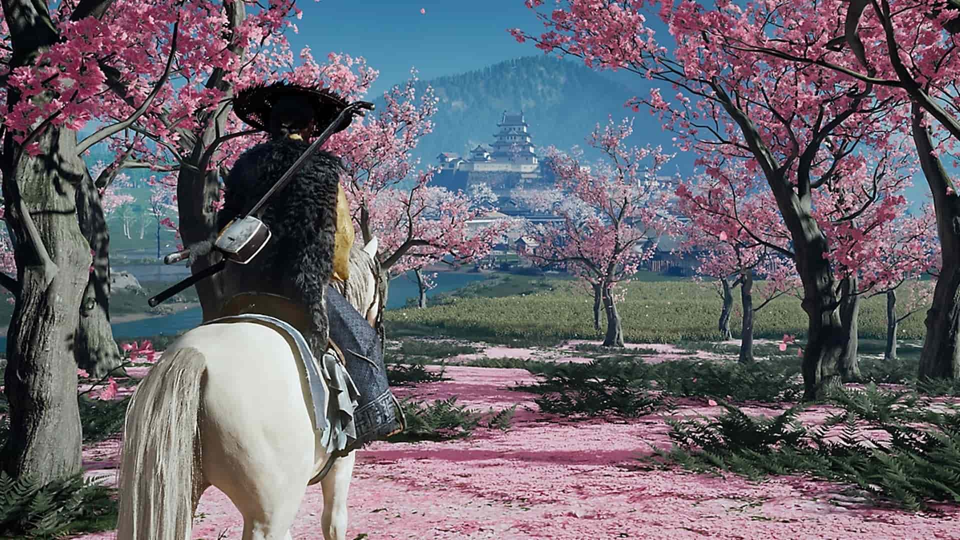 Samurai riding a horse through cherry blossom trees toward a distant castle in Ghost of Yotei