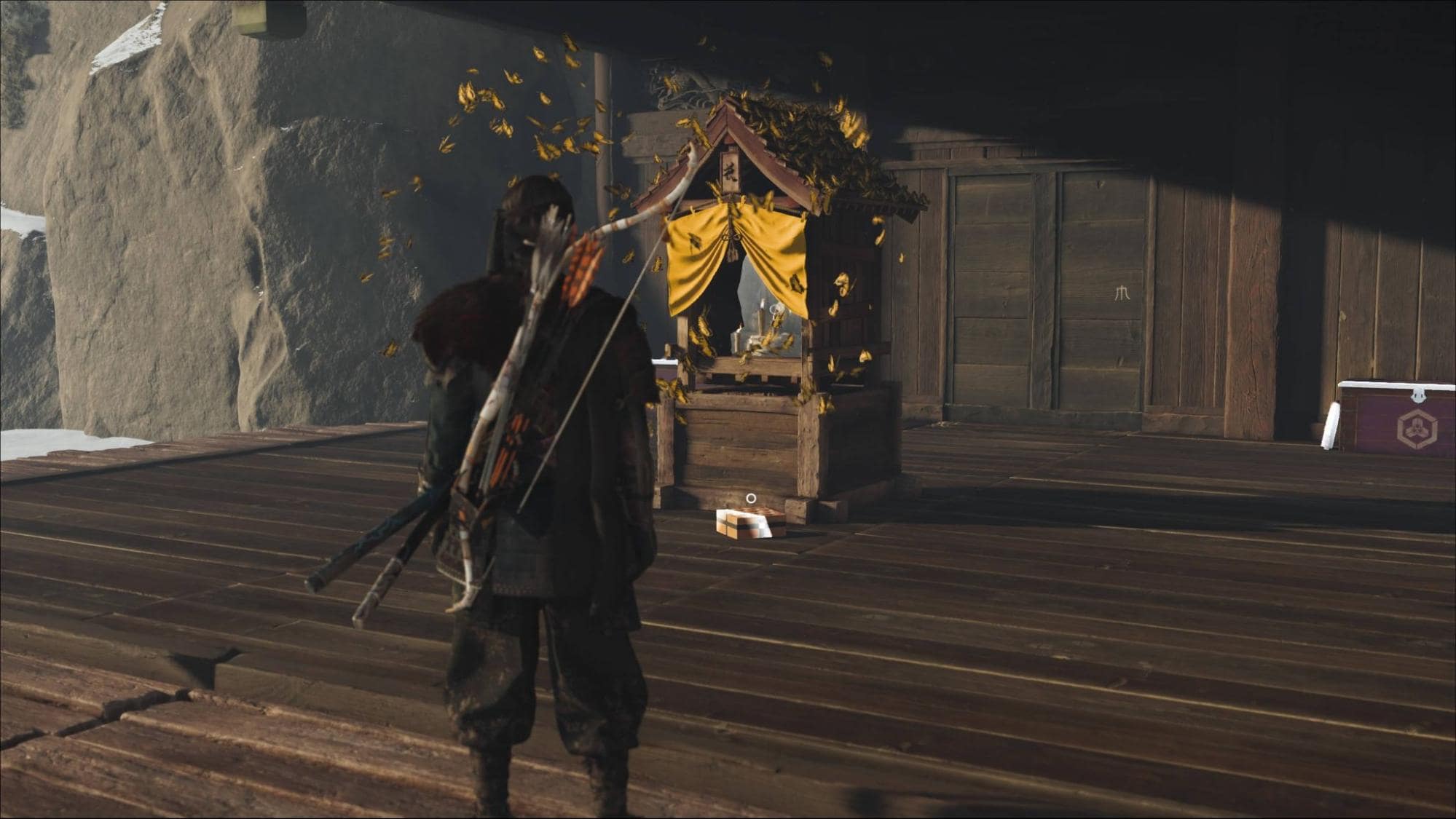 Player stands before the Altar of Reflection surrounded by drifting golden leaves at the Ghost of Yotei Snow Drift Springs Hideout
