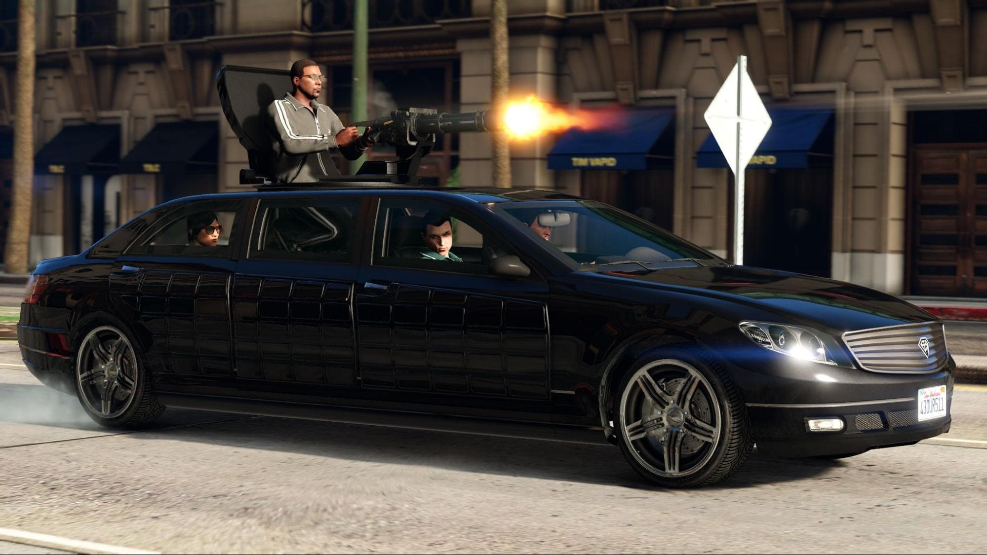 Player drives armored car with mounted gunner firing in urban chase scene from Grand Theft Auto 5