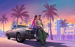 A man and woman sitting on a car in front of palm trees.