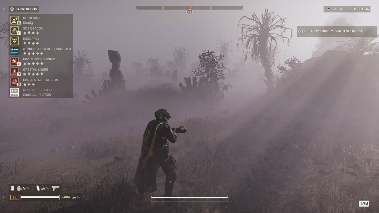 A videogame character in futuristic armor stands in a foggy, desolate landscape with ghostly trees and shrubs, displaying an airburst rocket launcher selection interface on the left side of the screen.