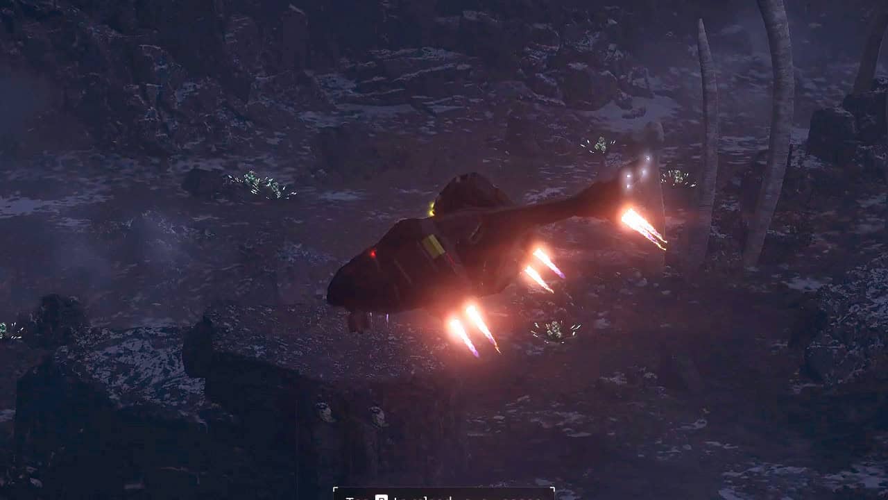 A Helldivers 2 spaceship with glowing thrusters hovers above a dark, rocky terrain at night.