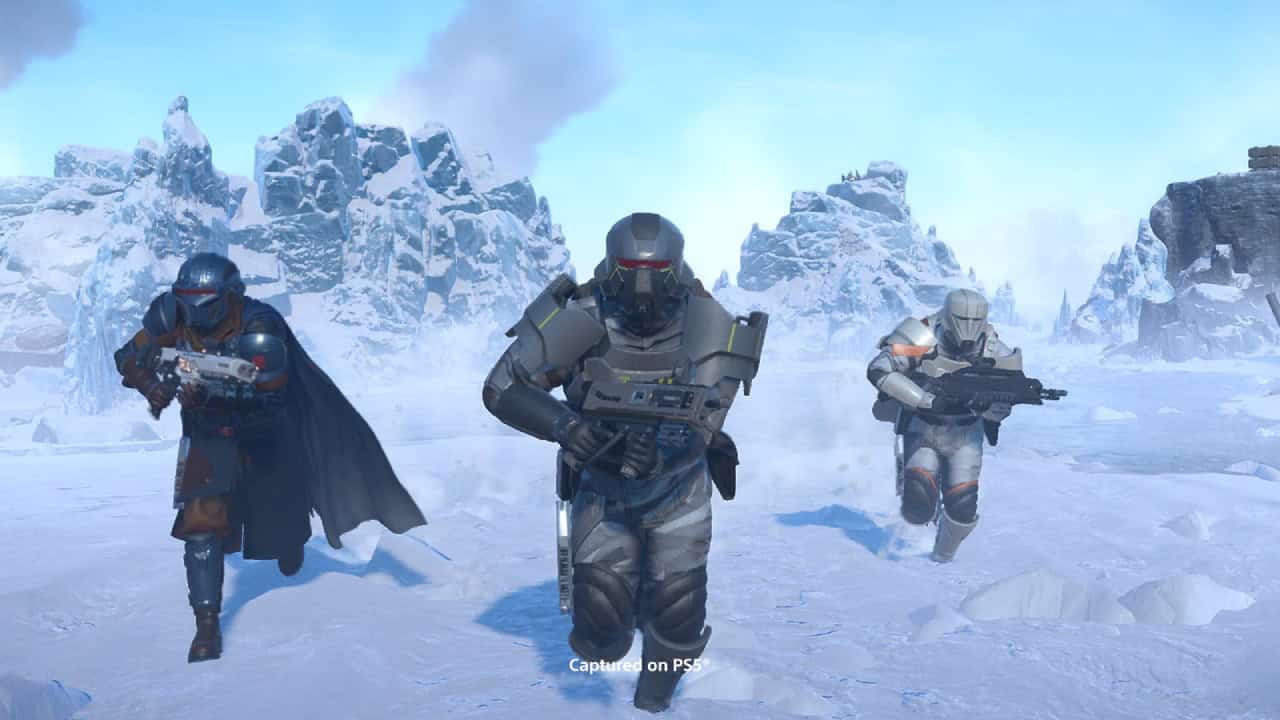 Three Polar Patriots armored soldiers with futuristic weapons advancing through a snowy landscape with jagged mountains in the background.