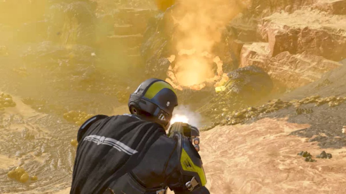 Helldivers 2 use the grenade launcher effectively - Player shooting grenade launcher at bug hole