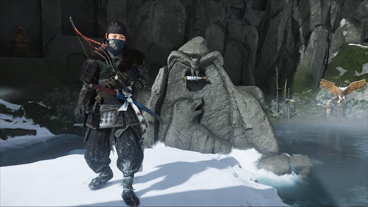 Character standing before a large stone owl statue holding the kusarigama weapon in Ghost of Yotei The Kusarigama’s Shame quest