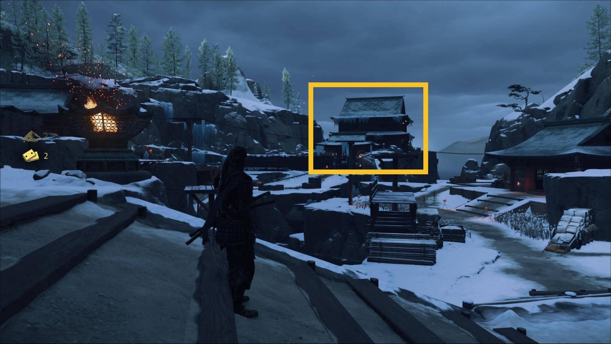 Ghost of Yotei Snow’s Drift Hideout with the target building ahead
