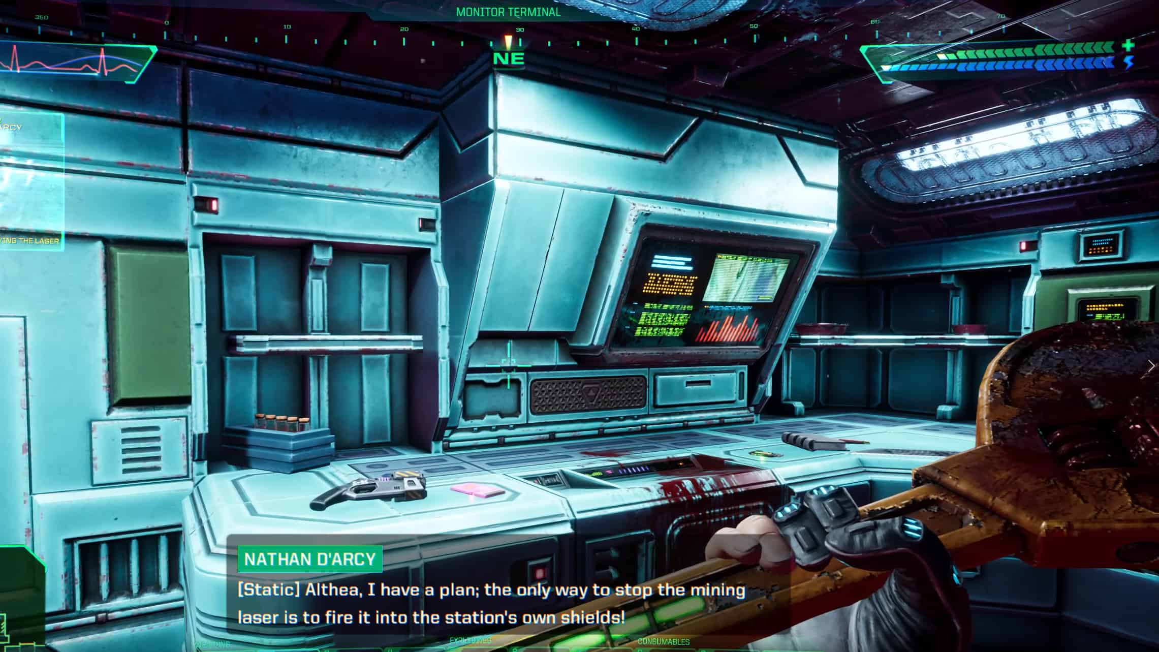 How to get guns early in System Shock: A room with a Sparobeam energy gun sitting on a blood-stained desk.